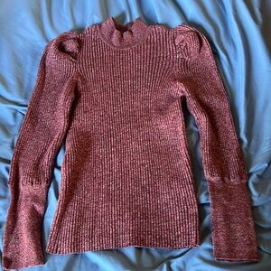 Woman’s large thicker sweater top.